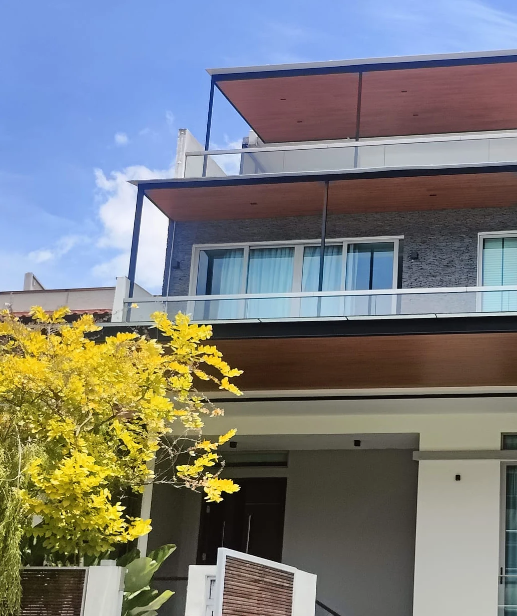 Landed house in Singapore with aluminium composite panel roofs on all three levels