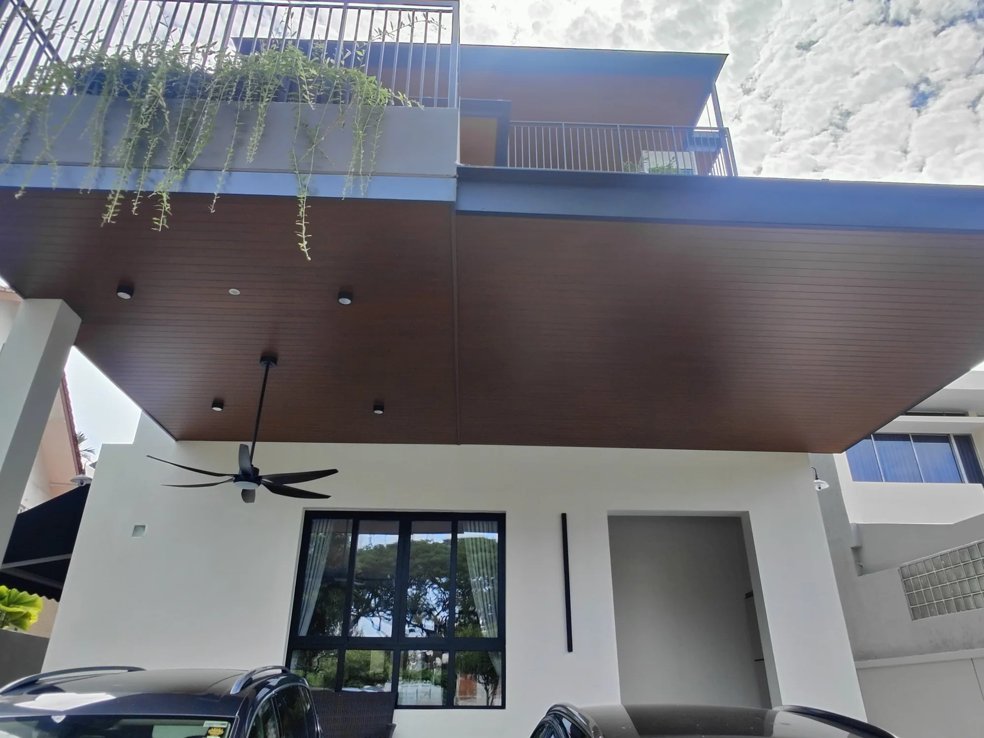 Carport with fan, aluminium composite panel roofing installed by Exterior Design in Singapore