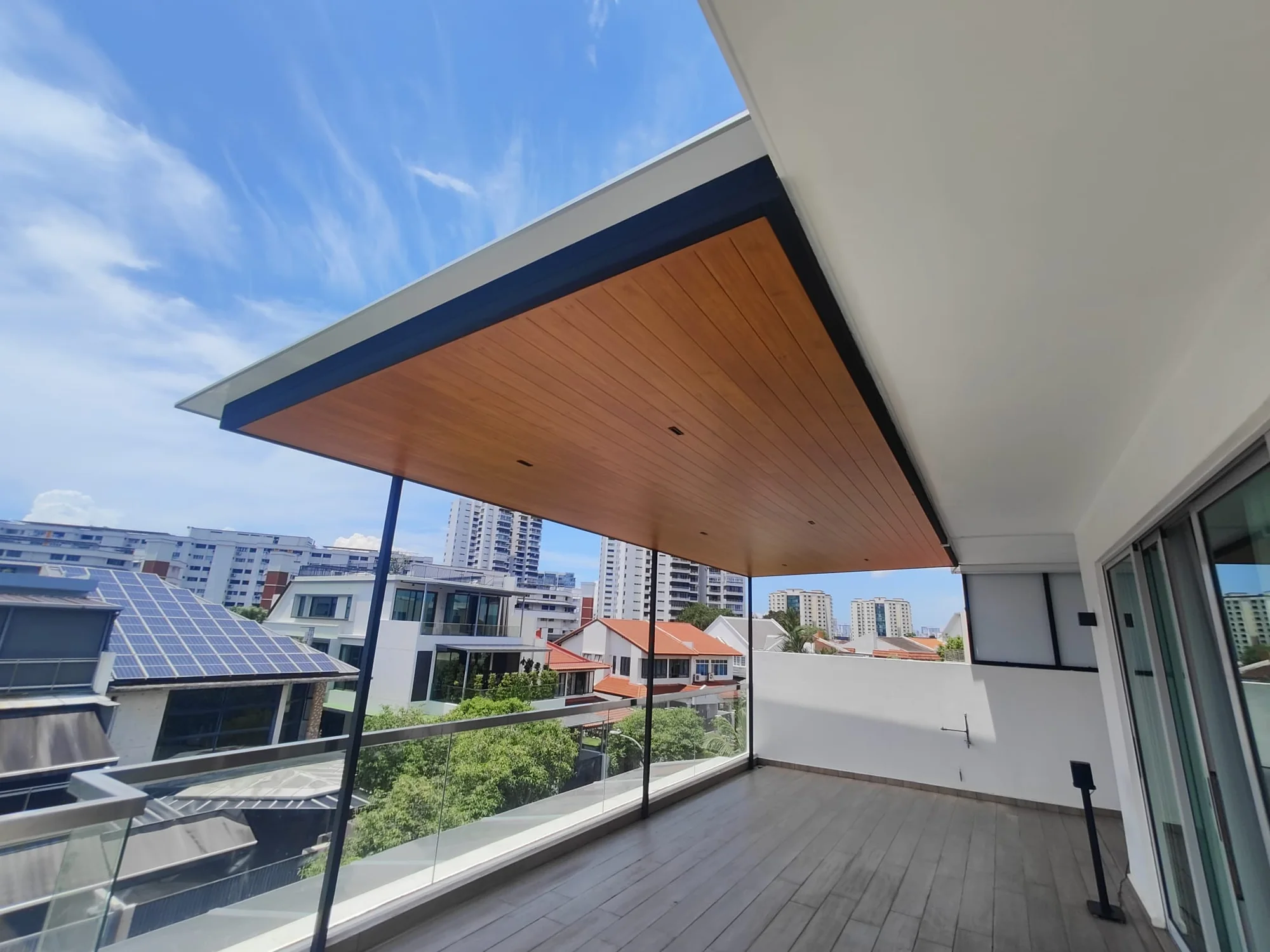 Deck under a new roof, aluminium composite panel roofing installed by Exterior Design in Singapore