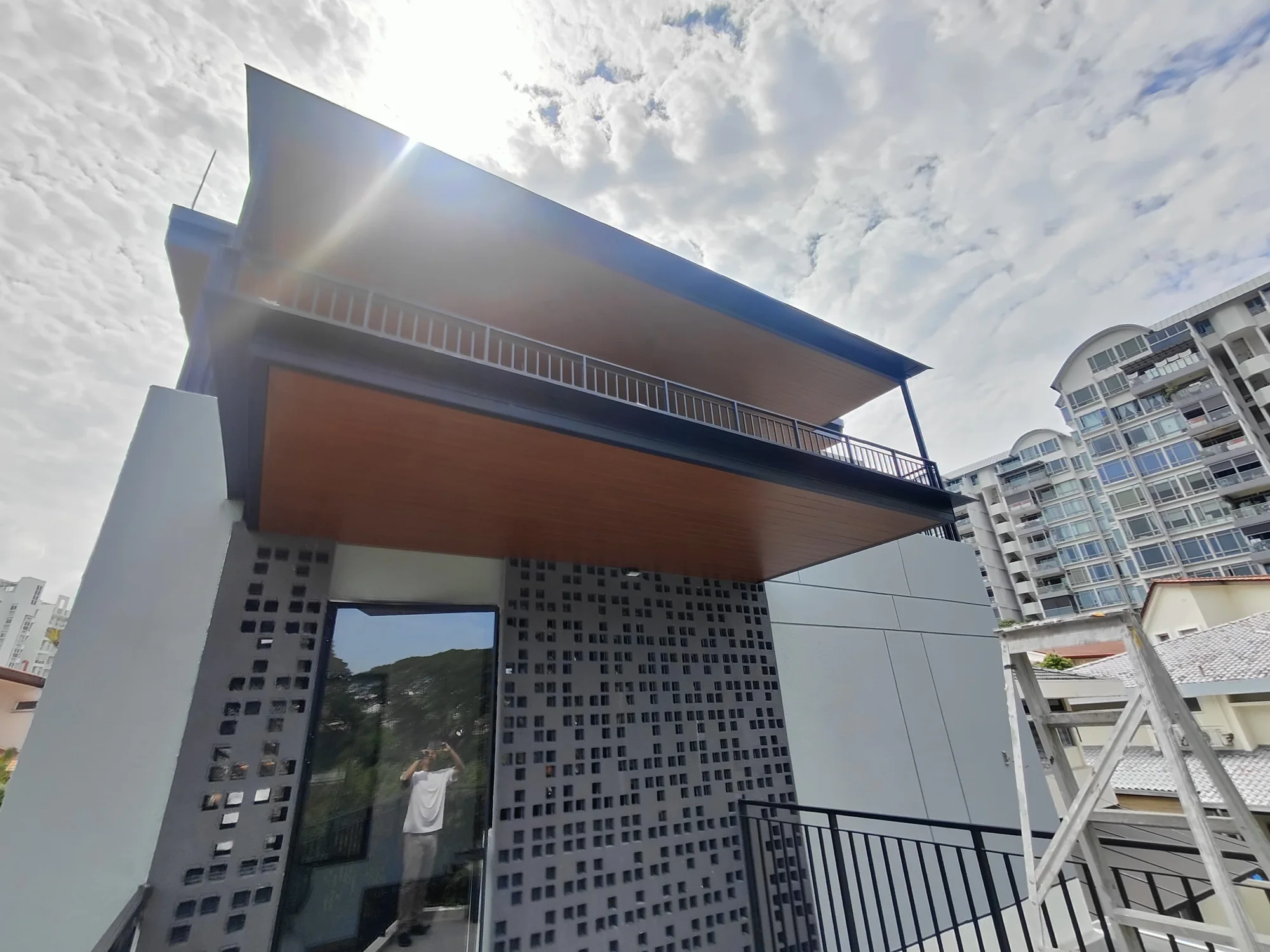 Aluminium composite panel roof against the sky, Singapore landed house
