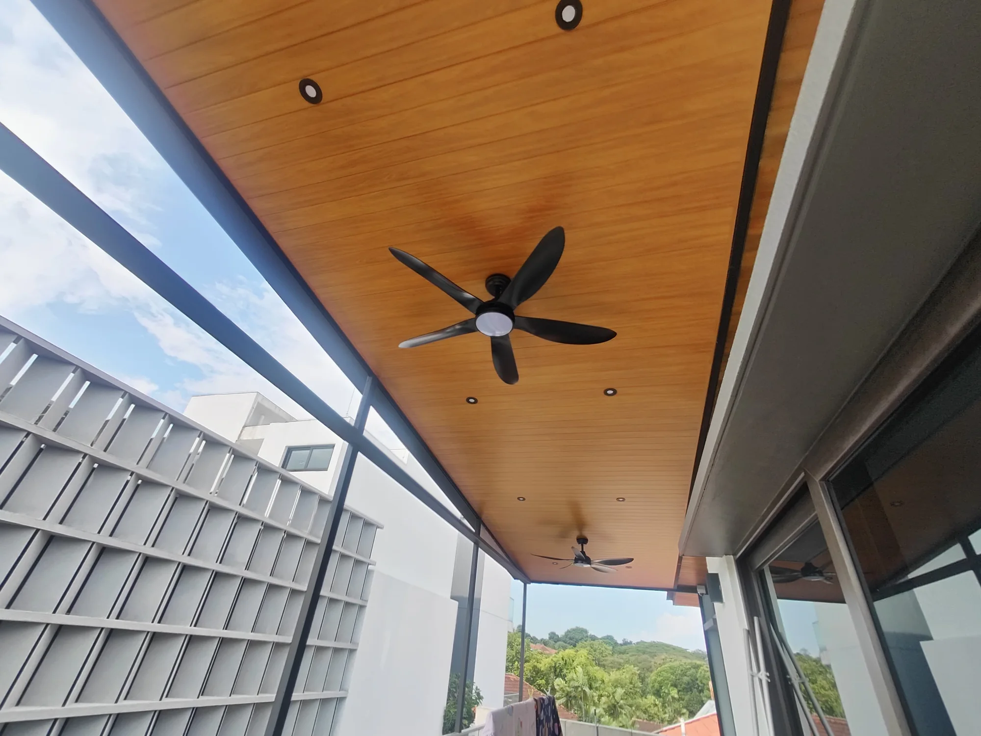 Fan and open sky, aluminium composite panel roofing installed by Exterior Design in Singapore