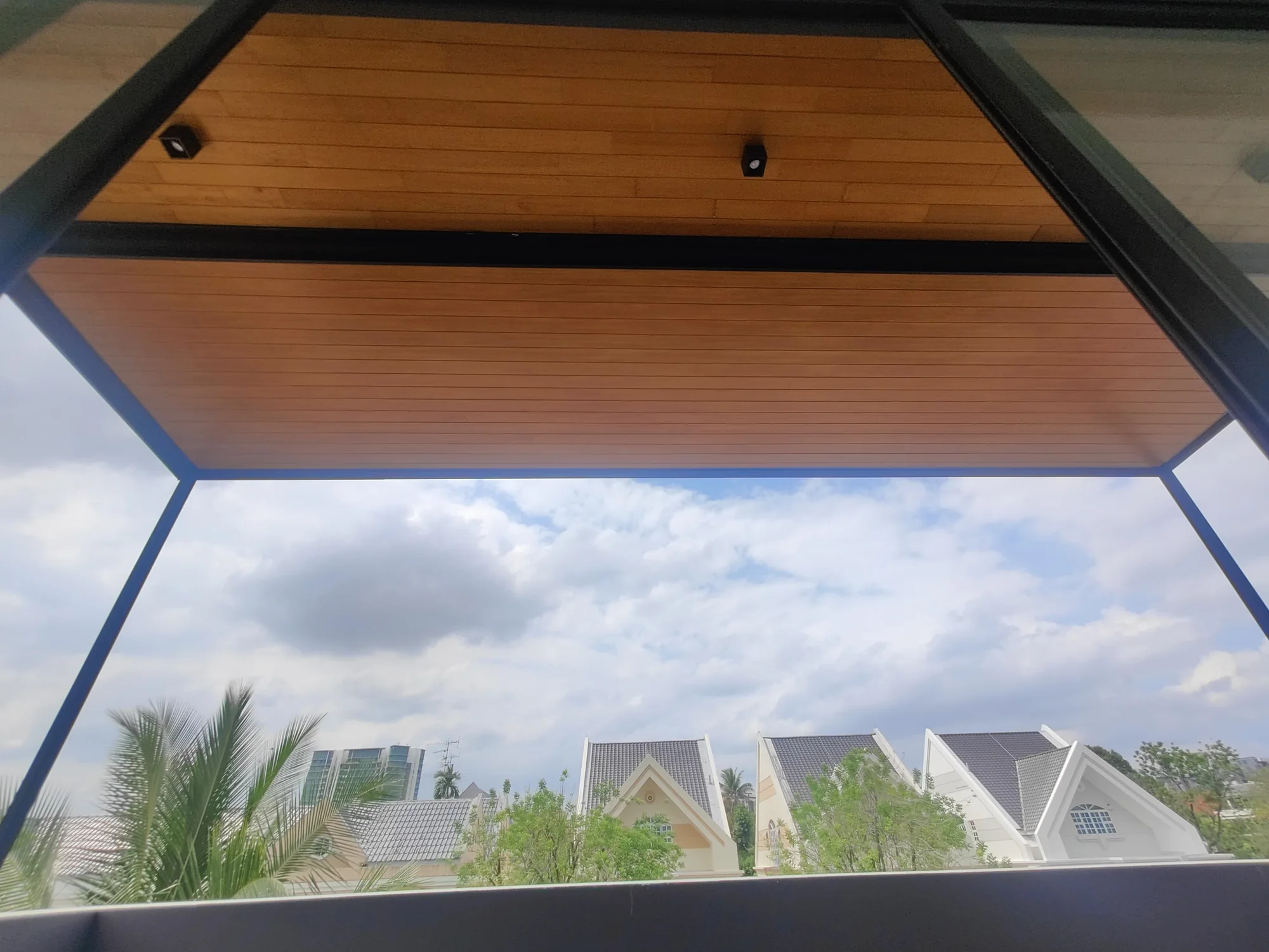 Soffit over the garden, aluminium composite panel roofing installed by Exterior Design in Singapore