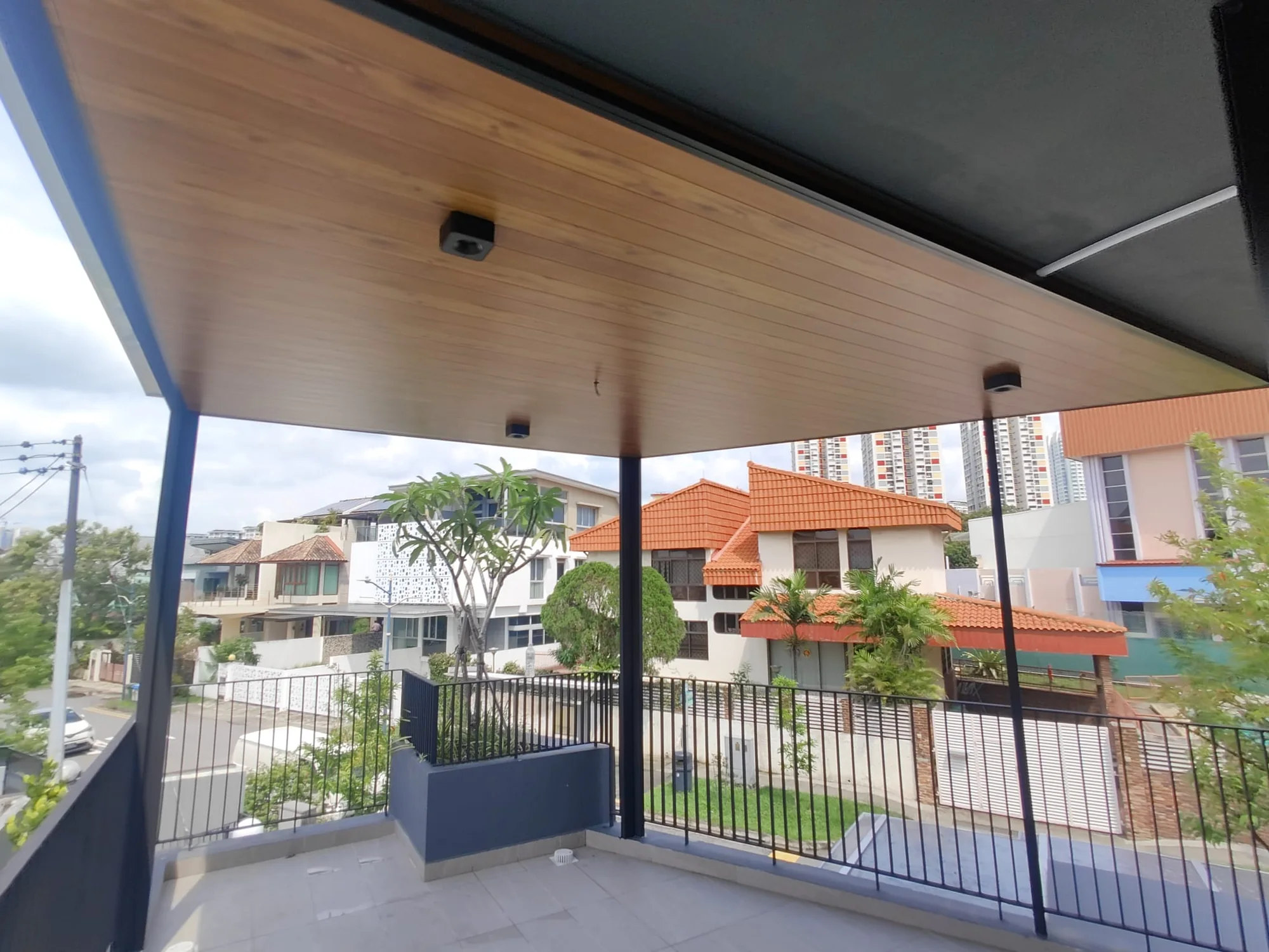 Full width terrace, aluminium composite panel roofing installed by Exterior Design in Singapore