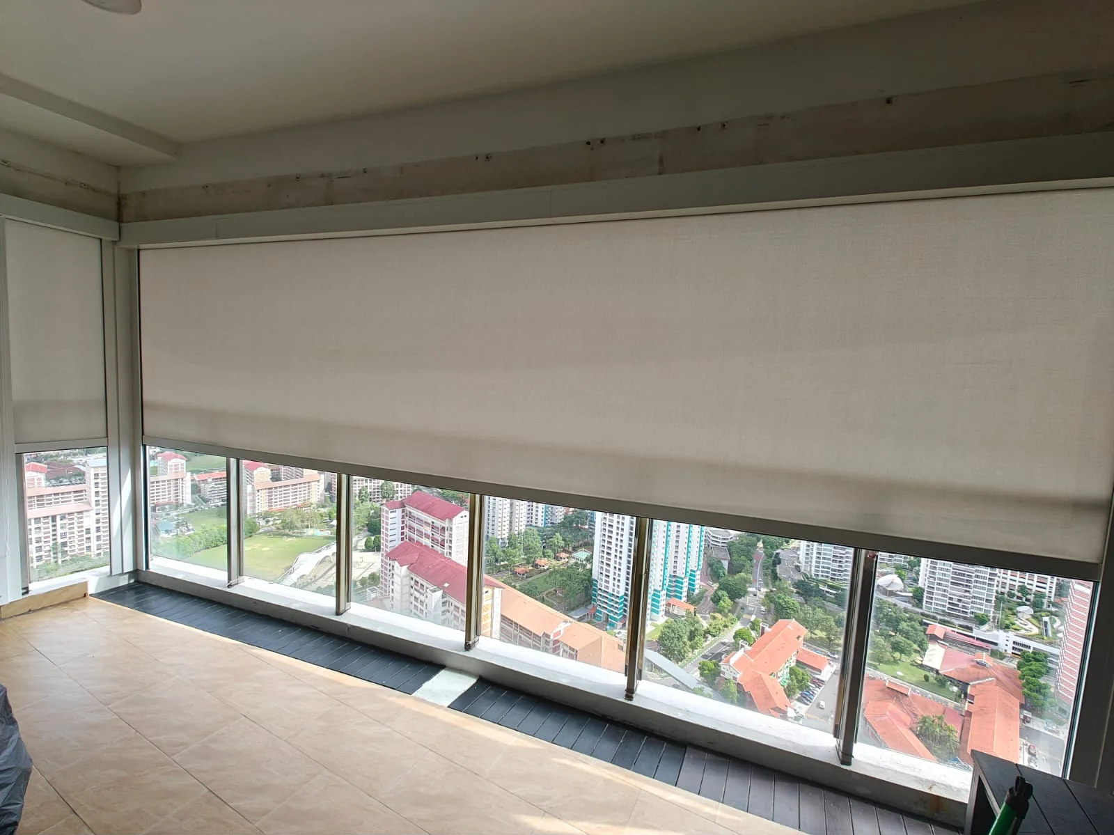 ZipNice zip blinds lowered across a Singapore condominium balcony