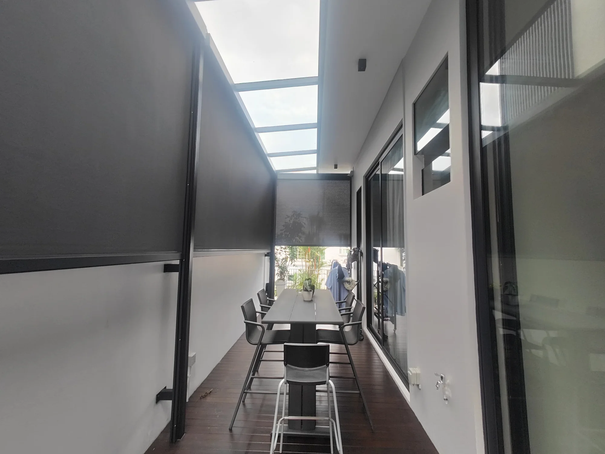 Under a skylight, ZipNice zip blinds installed by Exterior Design in Singapore